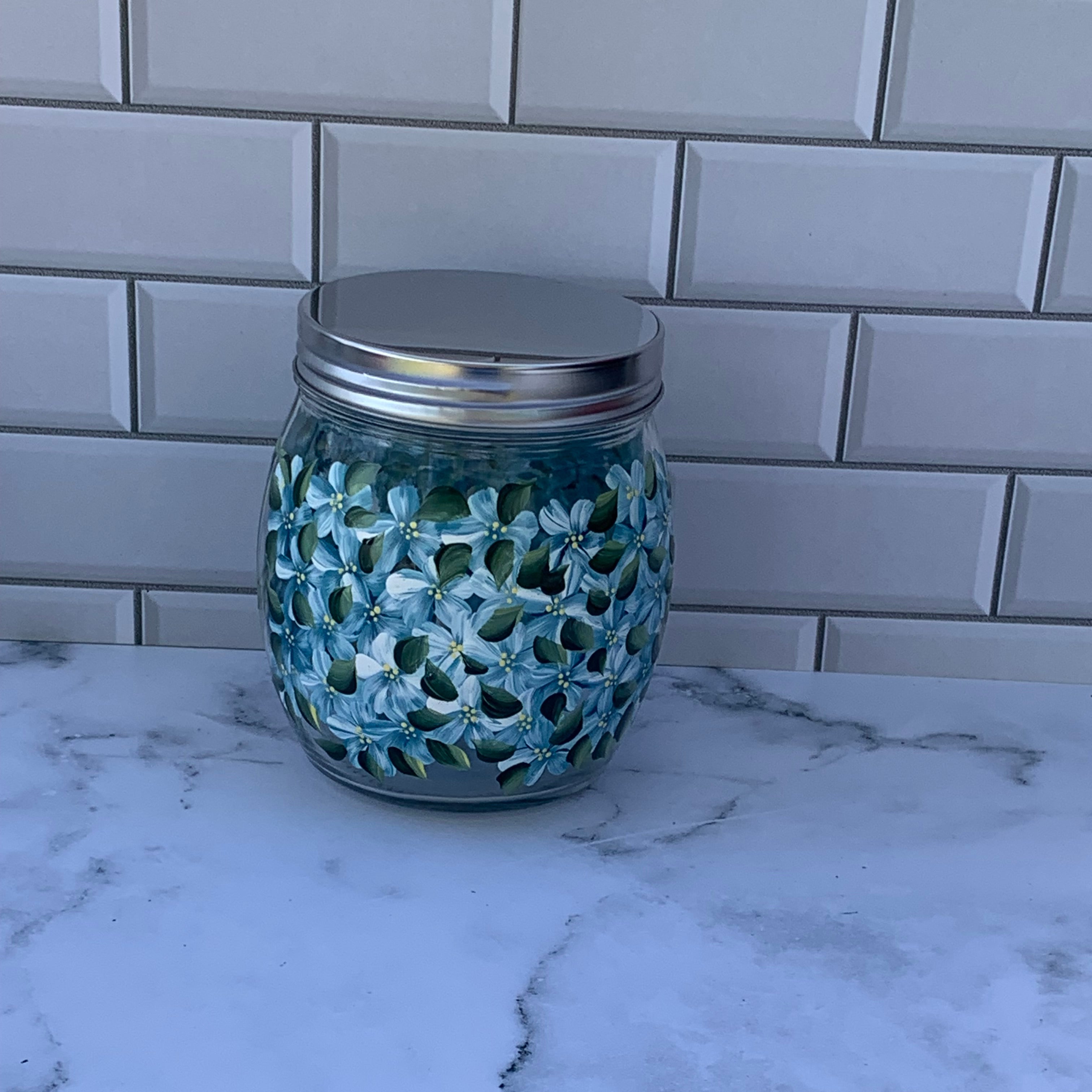 27 oz round glass storage jar with metal screw on lid hand painted with purple hydrangeas all around